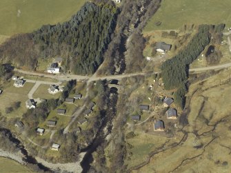Oblique aerial view centred on the road bridges, taken from the SE.