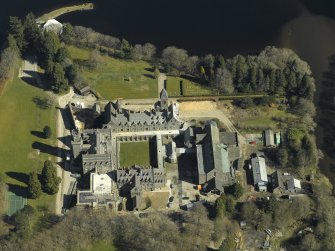 Oblique aerial view centred on the abbey and school, taken from the SW.
