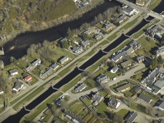Oblique aerial view centred on the locks with the swing bridge adjacent, taken from the SW.