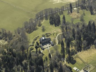 Oblique aerial view centred on the castle and garage, taken from the N.