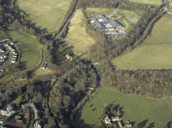 Oblique aerial view centred on Glenesk railway bridge and the site of Glenesk Junction with Elginhaugh Bridge in background, taken from the SE.