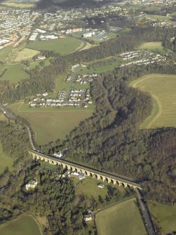 Oblique aerial view centred on Newbattle Railway Viaduct with King's Gate housing estate i the background, taken from the S.