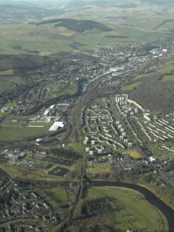 General oblique aerial view centred on Galashiels and Redbridge railway viaduct, taken from the SE.