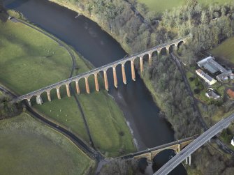 Oblique aerial view centred on the Leaderfoot railway viaduct, Drygrange Bridge and new road bridge, taken from the ESE.