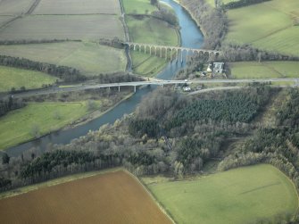 Oblique aerial view centred on the Leaderfoot railway viaduct, Drygrange Bridge and new road bridge, taken from the E.