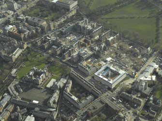 Oblique aerial view centred on the old Royal Infirmary hospital and George Heriot's School, taken from the NW.