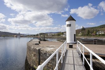 View.  From SE showing Corpach lighthouse, part of the outer lock gate and N pier.