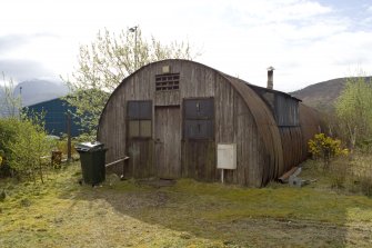 Detail.  From N showing surviving Nissen hut, possible mess hut on S side of site.
