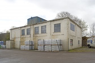 View.  From N of main workshop with water tank o roof.
