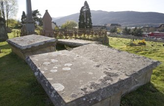 Detail.  Showing table gravestones from NE.