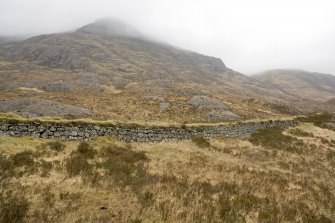 View from SSW.  Section crossing The Study showing S side of road stone revetting.