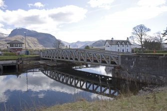 View from north showing Banavie railway swing bridge on the Caledonian Canal with signal box and canal cottages.