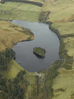 Oblique aerial view centred on the reservoir, dam and cottage, taken from the SW.