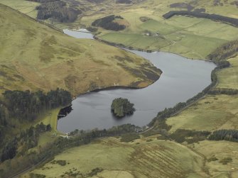 General oblique aerial view centred on the reservoir, dam and cottage, taken from the ENE.