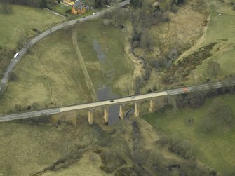 Oblique aerial view centred on the road bridge, taken from the NE.