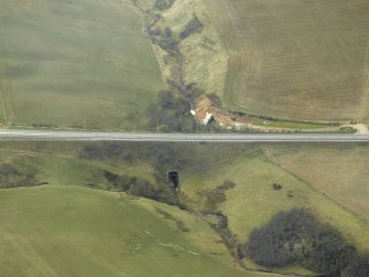 Oblique aerial view centred on the tunnel and the house, taken from the NE.