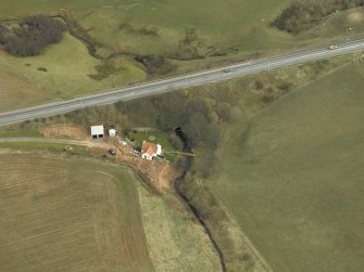 Oblique aerial view centred on the tunnel and the house, taken from the WSW.