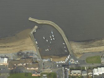 Oblique aerial view centred on the harbour and piers, taken from the S.