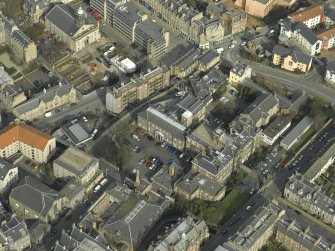 Oblique aerial view of the town centred on the university buildings, taken from the SW.