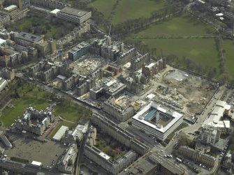 Oblique aerial view centred on the redevelopment of the hospital for housing, taken from the NW.