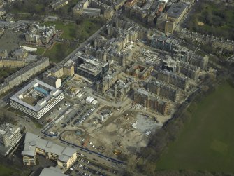 Oblique aerial view centred on the redevelopment of the hospital for housing, taken from the SW.