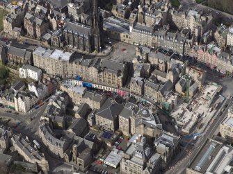 Oblique aerial view of Edinburgh's Old Town centred on Victoria Street with the church adjacent, taken from the SE.
