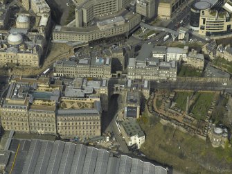 Oblique aerial view centred on the road bridge with the Old Calton burial-ground adjacent, taken from the SSE.