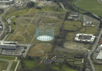 Oblique aerial view centred on the gasholder, taken from the ENE.