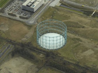 Oblique aerial view centred on the gasholder, taken from the NE.