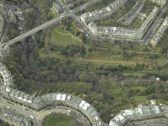 Oblique aerial view centred on the park and gardens with the road bridge adjacent, taken from the ESE.