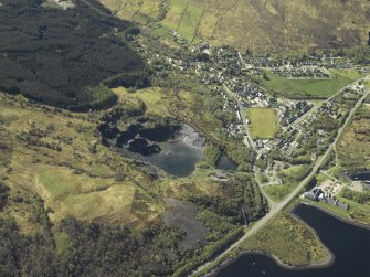 Oblique aerial view of the village centred on the slate quarries, taken from the NE.