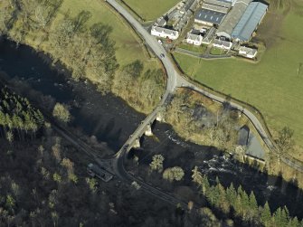 Oblique aerial view centred on the Yair Bridge and Fernielee Steading and Fernielee Sawmill, taken from the SE.