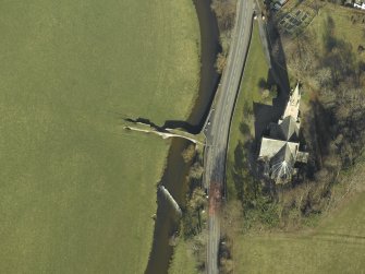 Oblique aerial view centred on Stow Kirk and Old Stow Bridge, taken from the SSW.