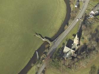 Oblique aerial view centred on Stow Kirk and Old Stow Bridge, taken from the SE.