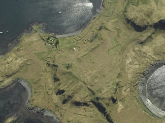 Oblique aerial view centred on the monument and the remains of the ammunition storage huts, taken from the N.