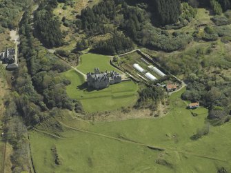 Oblique aerial view centred on the country house and walled garden, taken from the NNW.