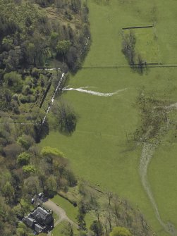 Oblique aerial view centred on the walled garden, country house and the remains of the burial-ground, taken from the NE.