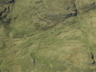 Oblique aerial view centred on the remains of the township, taken from the SE.