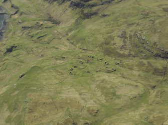 Oblique aerial view centred on the remains of the township, taken from the E.