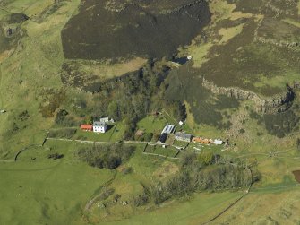 Oblique aerial view centred on the house, taken from the SSW.