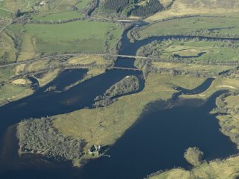 Oblique aerial view centred on the Awe rail bridge, Dalmally and the road bridge over River Orchy with the remains of Kilchurch Castle in the foreground, taken from the WSW.