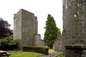 View of remains of original church from N