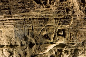 Detail of carving on cave wall at Sculptor's Cave, Covesea, showing fish and crescent and v-rod Pictish symbols
