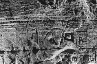 Detail of carving on cave wall at Sculptor's Cave, Covesea, showing fish and crescent and v-rod Pictish symbols (B&W)