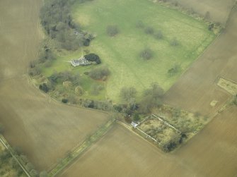 Oblique aerial view centred on the house and walled garden, taken from the E.