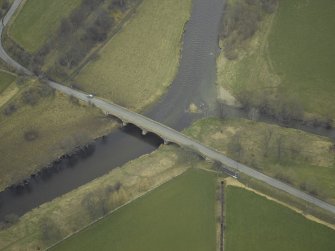 Oblique aerial view centred on Manor Bridge, taken from the SW.