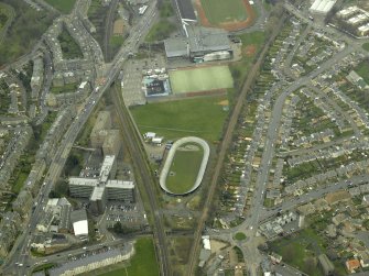 Oblique aerial view centred on Velodrome track and Meadowbank House, taken from the E.