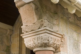 SW Entrance porch. Column capital. Detail