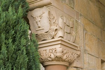 SW Entrance porch. Column capital. Detail