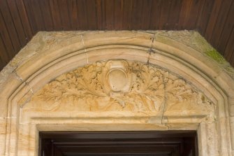 SW Entrance porch. Door pediment. Detail